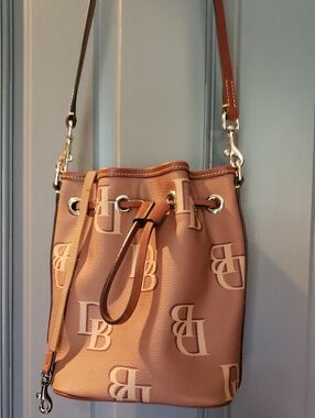 Dooney & Bourke Tan and Cream Monogram Bucket Bag